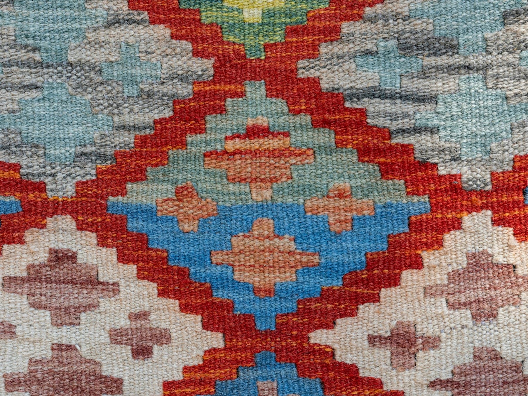 Indigo Diamond, a flat-woven wool rug, shown flat