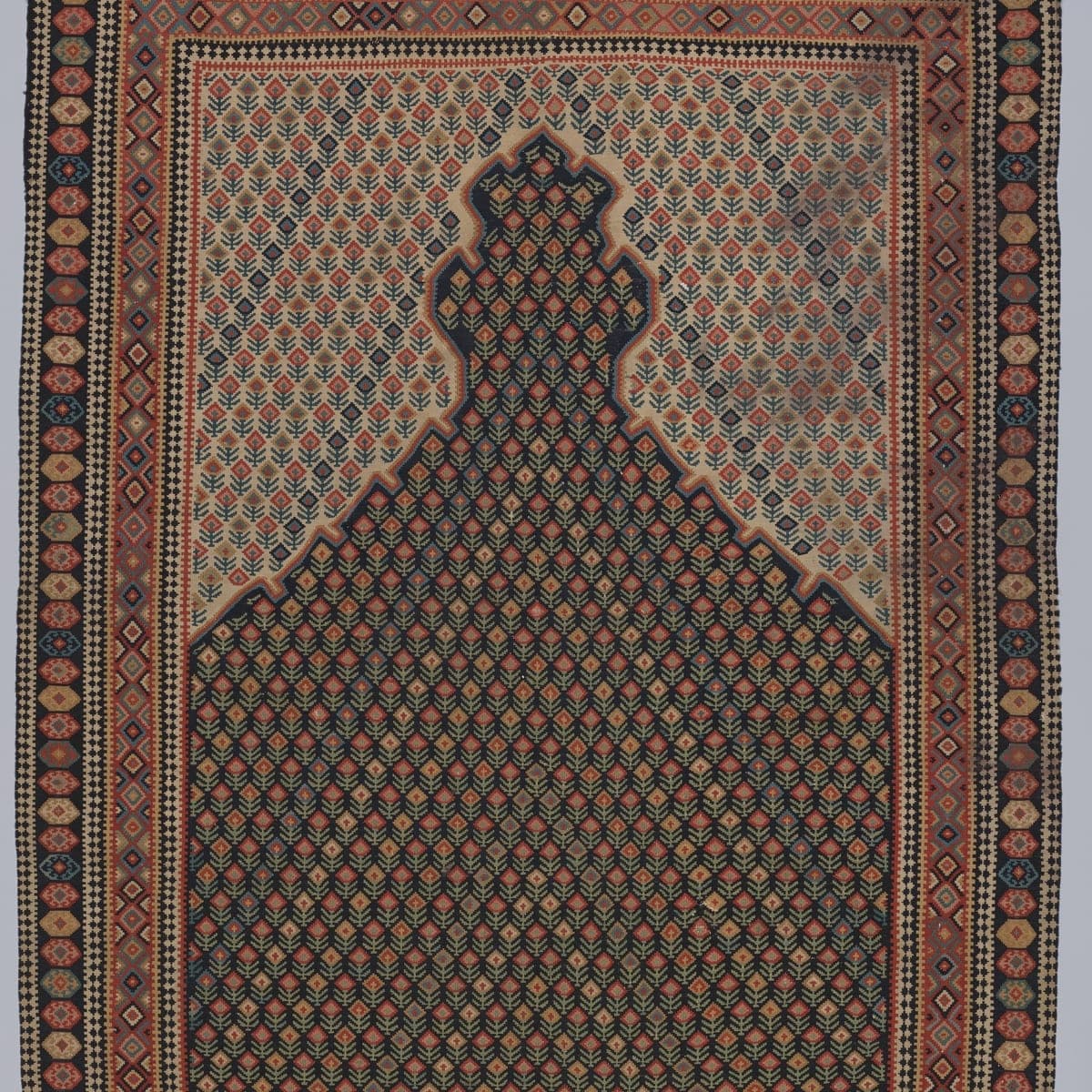 Close-up of the geometric pattern on the Senneh Boteh Kilim