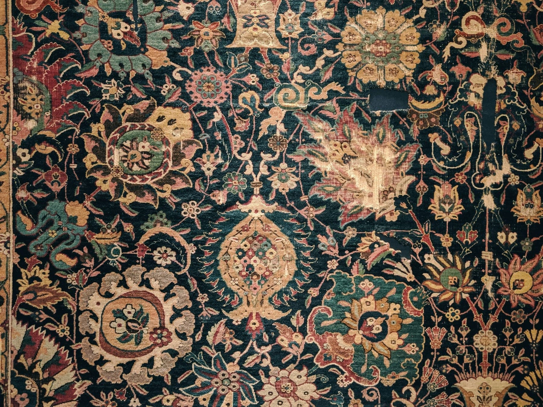 Mashhad Indigo Bloom, a hand-knotted wool rug, shown flat