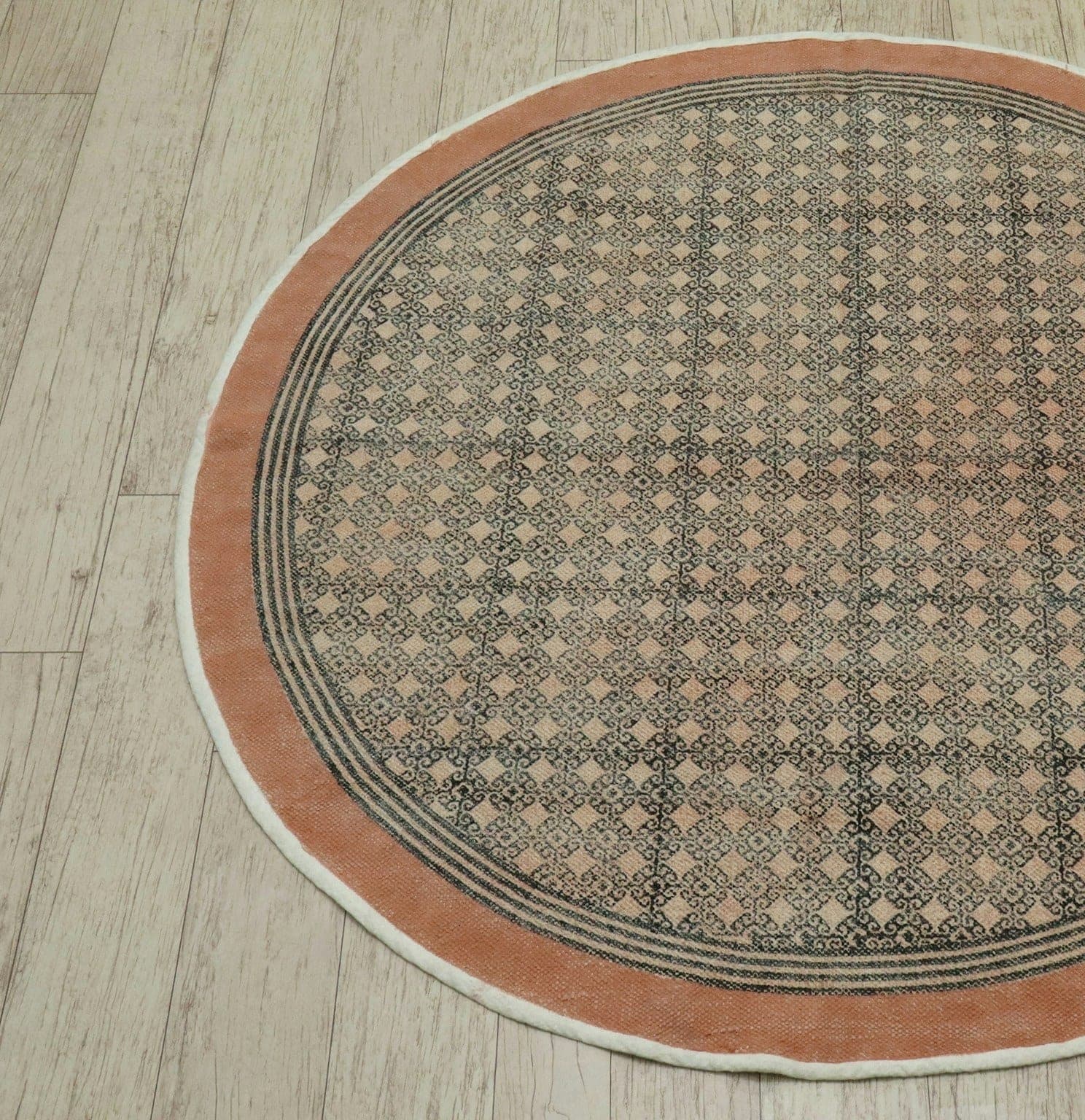 Terracotta Halo Round, a flat-woven cotton rug, shown flat
