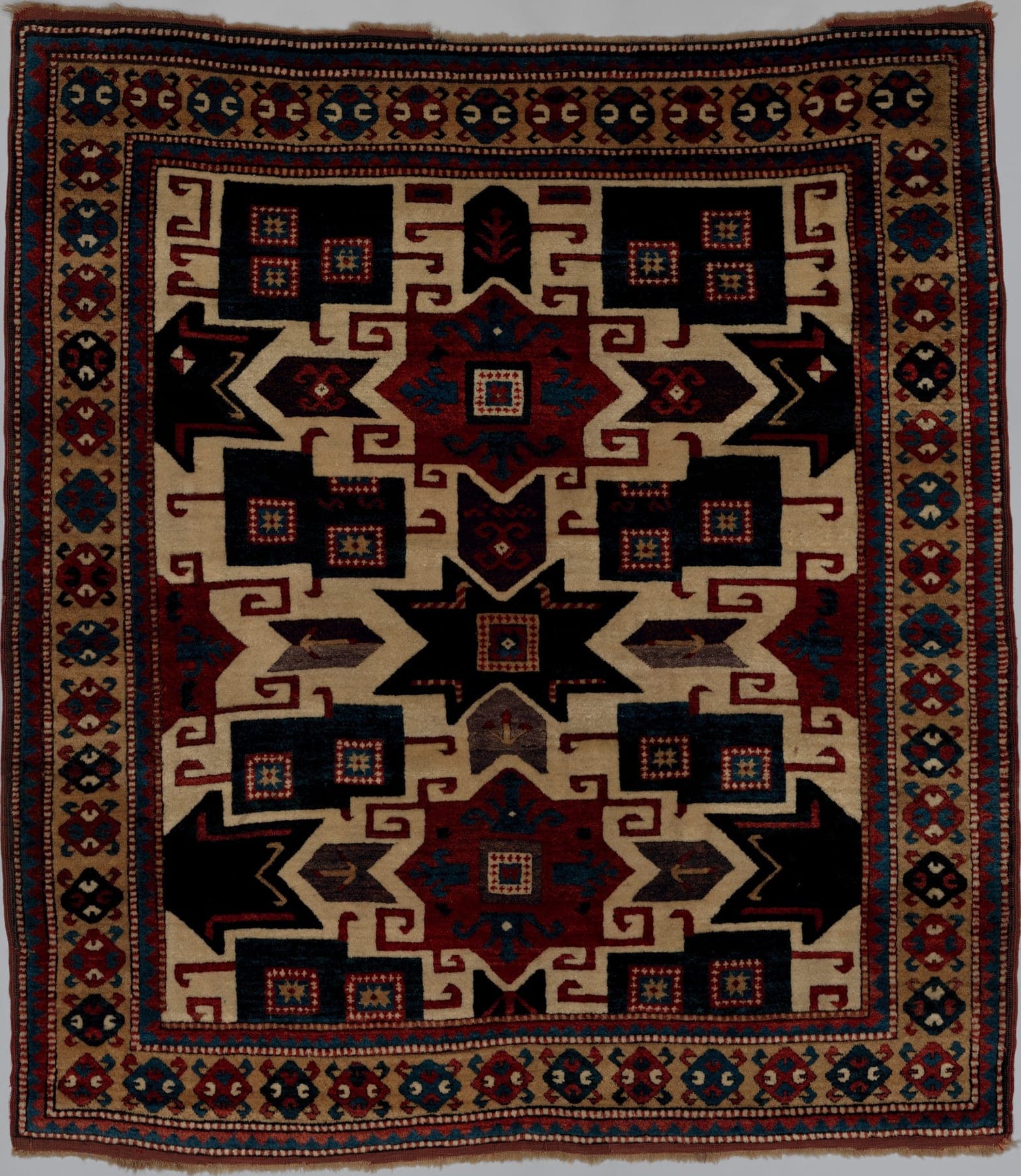 Star Kazak Noir, a hand-knotted wool rug, shown flat